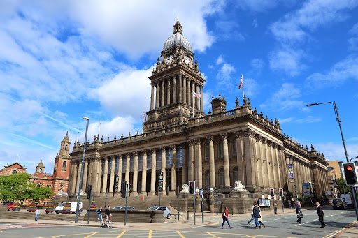People visiting the City Hall in Leeds, England.