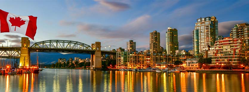 Canadian flag in front of view in Vancouver Downtown,British Columbia, Canada
