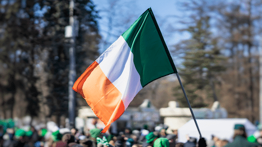 Irish flag held above crowd outside