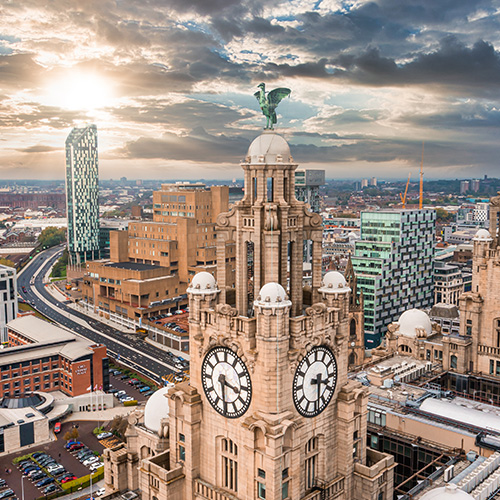 Aerial close up of the tower of the Royal Liver Building in Liverpool, UK during beautiful sunset