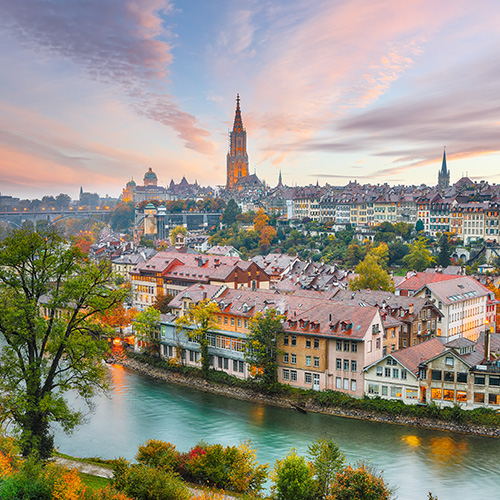 Fabulous autumn view of Bern city on Aare river during evening with Cathedral of Bern on background Location Bern Canton of Bern Switzerland Europe