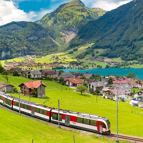 Famous electric red tourist panoramic train in swiss village lungern canton of obwalden switzerland