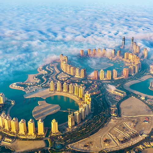 aerial view of the pearl-qatar island in doha through the morning fog - qatar, the persian gulf. UAE