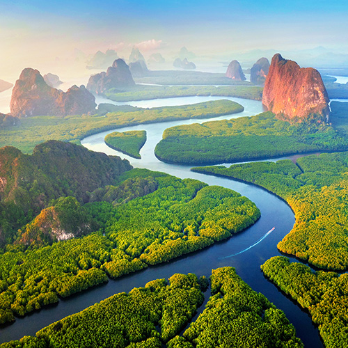 phang nga bay with mountains at sunrise in thailand