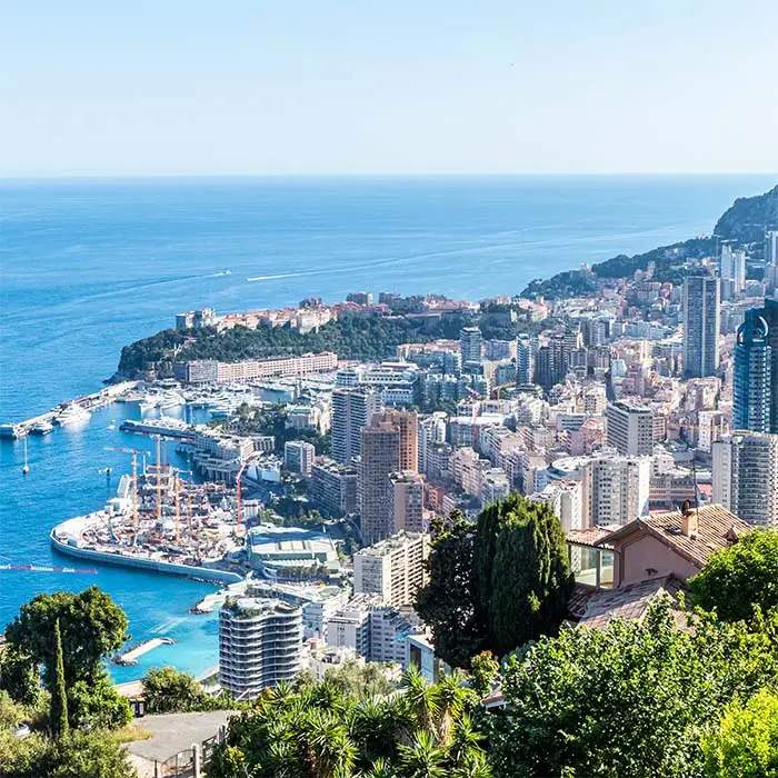 Aerial view of monaco with skyscrapers and blue sea