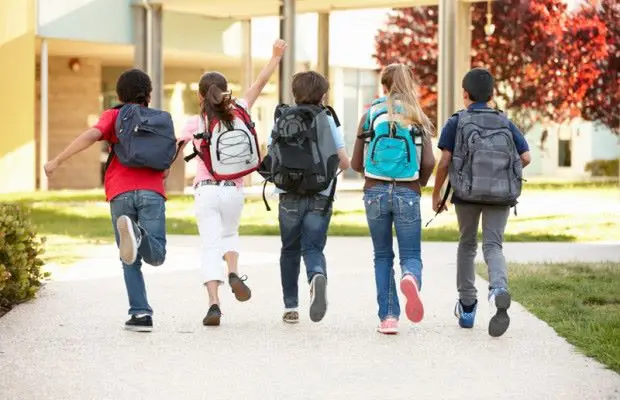 School Children running into school
