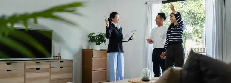 young couple with a real estate agent visiting home for buy or for rent