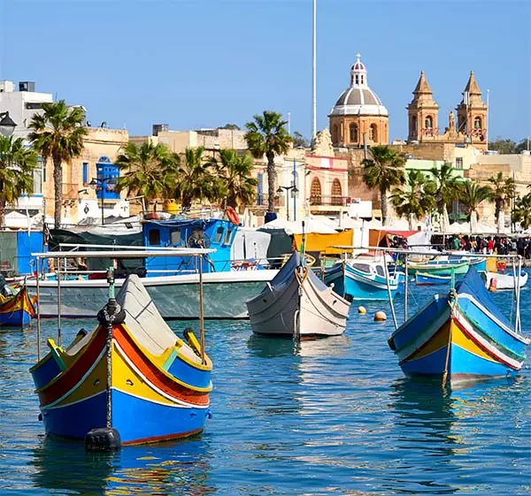Marxaslokk harbor with traditional maltese eyed boats - luzzu on the bright sunny day