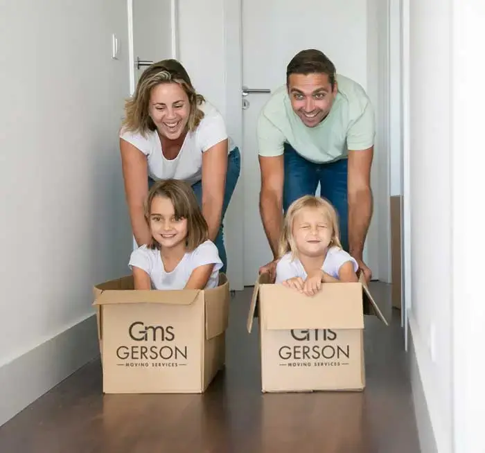 Mum-and-dad-pushing-cardboard-boxes-with-kids-inside