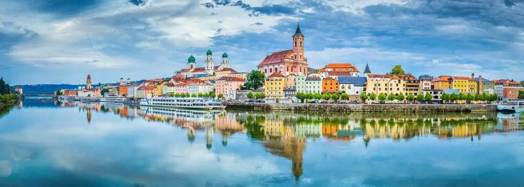 Panoramic view of the historic city of Passau reflecting in famous Danube river in beautiful evening light at sunset, Bavaria, Germany