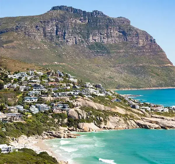 beautiful-shot-buildings-hill-turquoise-beach-cape-town-south-africa.jpg