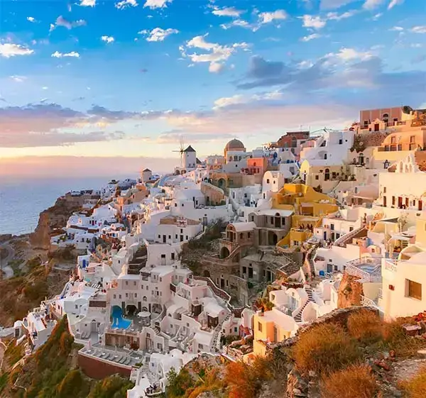 picturesque-view-old-town-oia-ia-island-santorini-white-houses-windmills-church-with-blue-domes-sunset-greece