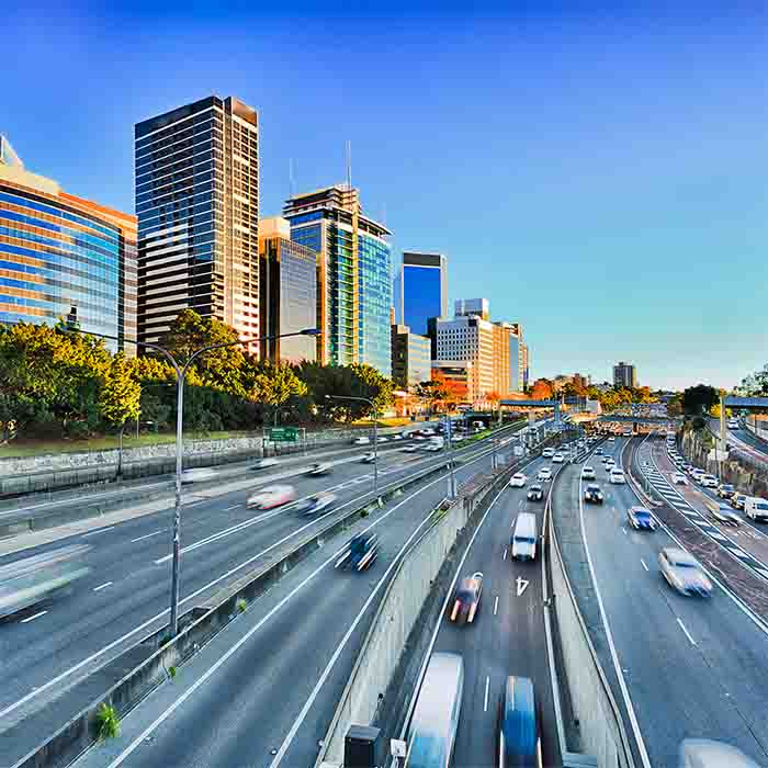 Wide view of multi lane Warringah freeway going through North SYdney during morning rush hour traffic peak and congestion in Australia
