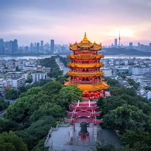 Majestic temple overlooking the urban skyline at sunset