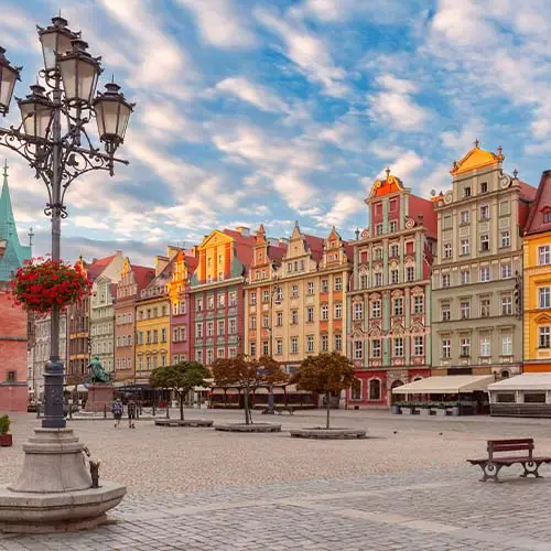 Morning view of colorful buildings on rynek square in wroclaw poland with street lamps