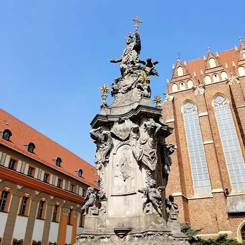 Vertical shot of a statue outside the Cathedral of St. John the Baptist Warsaw, Poland