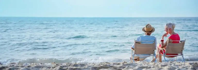 Senior couple relaxing and spend time together on the beach abroad