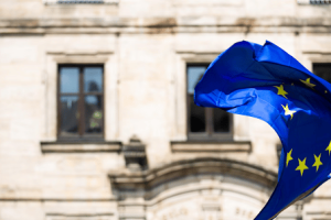 European flag waving in front of a parliament building